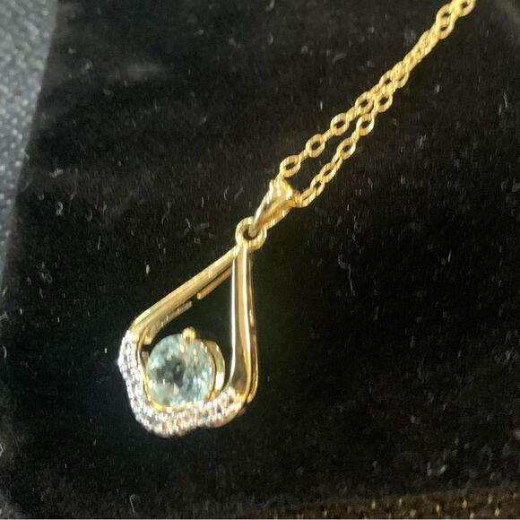 14 Karat White Gold Blue Topaz Birthstone Round Blue Topaz  Natural Blue topaz and white zircon in 14k yellow gold plated necklace. 18”